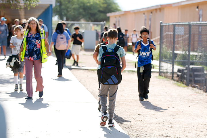 Students walk outside between classes